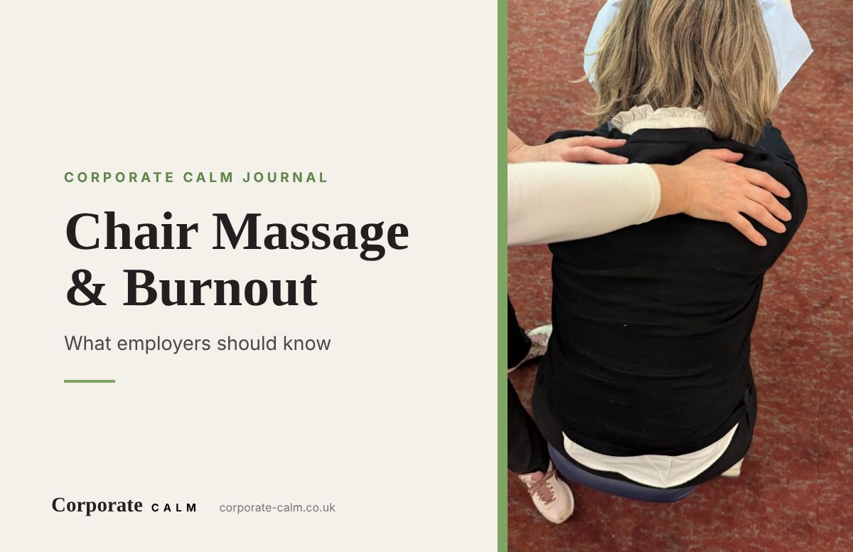 Therapist's hands working on a client's shoulders during a fully-clothed chair massage