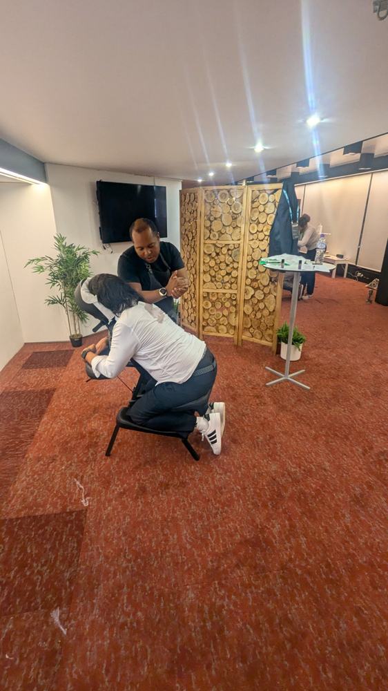 Staff member enjoying a chair massage during an office wellness day