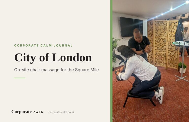 Massage therapist giving a seated chair massage at a corporate event in central London